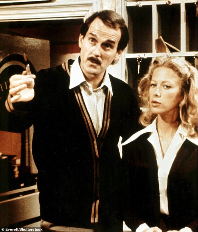 John Cleese and Connie Booth are photographed as Basil Fawlty and Polly Sherman in Fawlty Towers