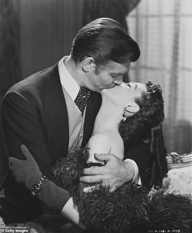 Today, kissing has a multitude of uses - including a signifier of romantic and sexual attraction, commonly depicted in the movies. Pictured, Rhett Butler (Clark Gable) and Scarlett O'Hara (Vivien Leigh) in 'Gone with the Wind' (1939)