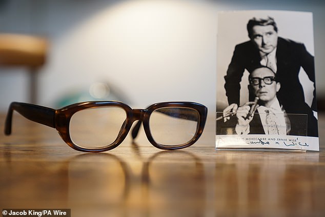 Fans of the comedy star are being given the opportunity to own some of his belongings by Morecambe's three children, Gail, Gary and Steven. Pictured: Glasses and a pipe belonging to Eric Morecambe on display ahead of the auction