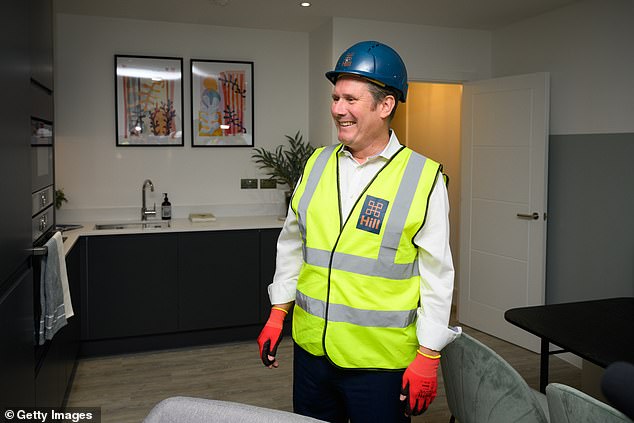 Sir Keir Starmer looks around a completed apartment at a housing development in Walthamstow, England - August, 2022