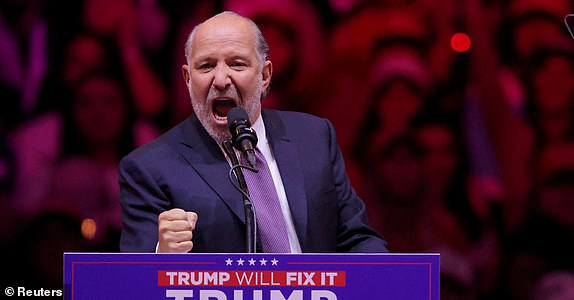 FILE PHOTO: Howard Lutnick, Chairman and CEO of Cantor Fitzgerald, gestures as he speaks during a rally for Republican presidential nominee and former U.S. President Donald Trump at Madison Square Garden, in New York, U.S., October 27, 2024. REUTERS/Andrew Kelly/File Photo