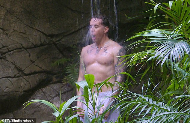 Danny Jones braved the first ice cold shower of the 2024 I'm A Celebrity...Get Me Out Of Here! series as he stripped down to a pair of white swimming shorts showcasing his toned abs