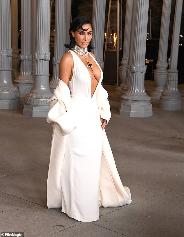 Kim Kardashian, 44, is facing flak online after promoting Elon Musk's products , with some saying that her association with the Tesla billionaire, 53, was a signal she was supporting President-elect Donald Trump, 78. Pictured earlier this month at the LACMA gala in LA