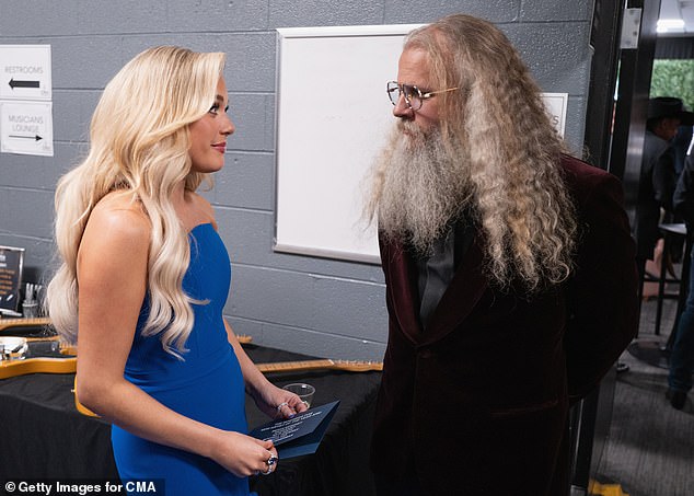 Johnson was pictured chatting with Megan Moroney, 27, at the award show in Music City