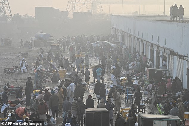 Researchers from the Max Planck Institute for Chemistry used advanced numerical simulations to estimate the mortality attributable to air pollution and extreme temperatures. Pictured: Lahore in smog on November 21