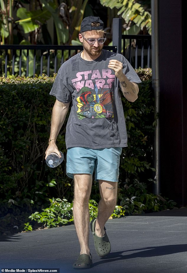 The reality star rocked an oversized Star Wars T-shirt with his swimming trunks and kept comfortable in a pair of khaki crocs as he arrived at the pool