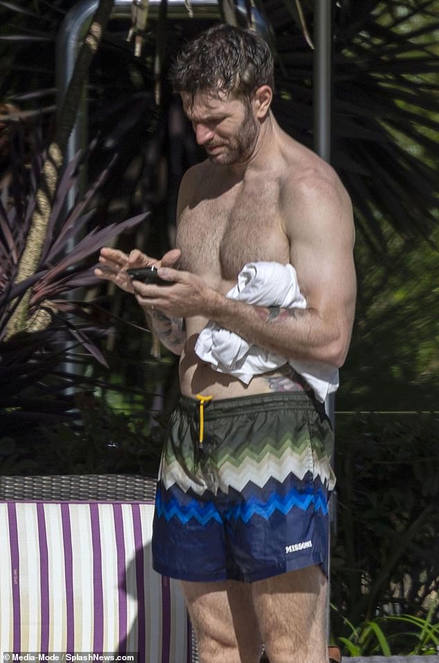 Meanwhile comedian Joel, who was crowned runner-up of the show in 2016, showed off her muscular frame in a pair of green and blue swimming shorts