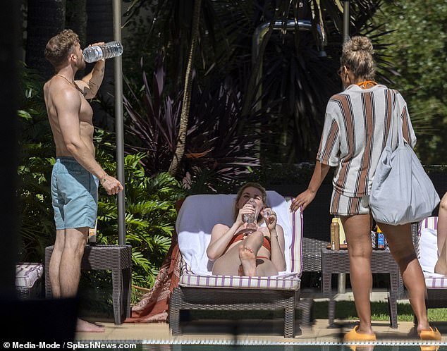 Sam, Hannah and Kemi were seen laughing around the pool