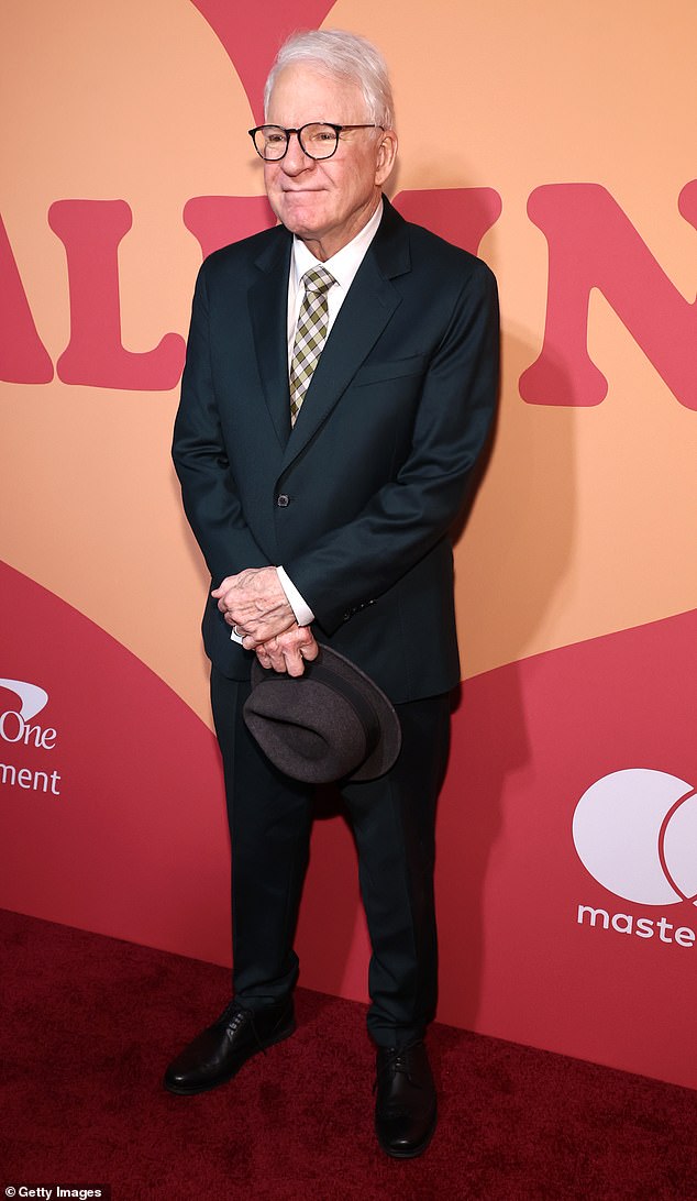 Steve Martin, 79, looked great in a dark suite, black dress shoes, and dark gray fedora hat