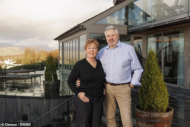 Catherine Carwardine (pictured with her husband Chris) won the stunning six bedroom home in a 2022 Omaze Grand Prize draw