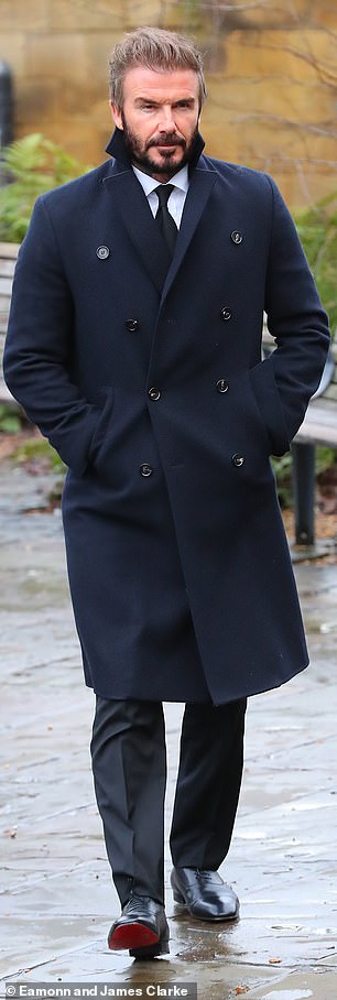 Beckham wore a trench coat with a black tie for the funeral