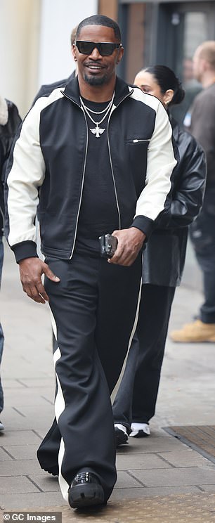 Jamie left Heart Studios shortly before, looking suave in a black and white ensemble