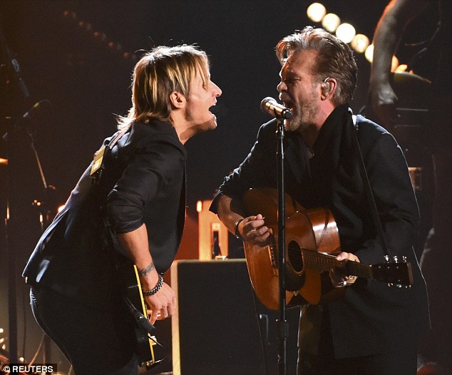 Duet: Keith Urban took the stage with John Mellencamp at the start of the ceremony