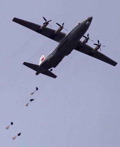 Chinese paratroopers jump from a Chinese Y-8.-AP Photo