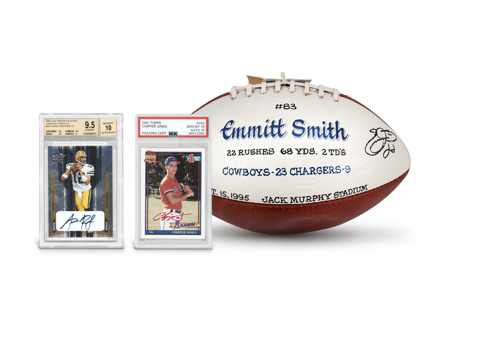 A graded Aaron Rodgers 2005 rookie card, a graded Chipper Jones 1991 rookie card, and an autographed Emmitt Smith football sit against a white background.