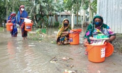 Women along the flooded Jamuna River in Bangladesh, July 2020.