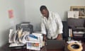 Bansal Oreus helps other Haitian immigrants with government documents at the St. Vincent de Paul Society in Springfield, Ohio, U.S., August 15, 2024. REUTERS/Howard Schneider