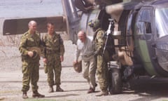 Australian Prime Minister John Howard emerges from a Black Hawk helicopter as IN<br>(AUSTRALIA OUT) Australian Prime Minister John Howard emerges from a Black Hawk helicopter as INTERFET Commander Major-General Peter Cosgrove, left, looks on at Batugade, East Timor, 28 November 1999. SMH Picture by ANDREW MEARES (Photo by Fairfax Media via Getty Images/Fairfax Media via Getty Images via Getty Images)