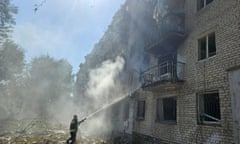 Firefighters at work at the site of Russian missile attacks on the central-eastern Ukrainian city of Pavlograd