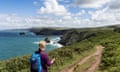 A lone walker on the South West Coast Path between Tintagel and Boscastle in Cornwall.