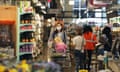 People shop in a grocery store in Washington DC.