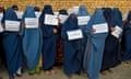 Women hold placards as they protest for their right to an education Afghanistan.