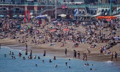 Crowds gather on Brighton beach, Sussex