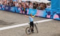 Remco Evenepoel celebrates after crossing the finish line to win the men’s cycling road race, adding to the gold he won in the time trial.