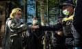 Victoria police search the bag of a protester on Thursday as anti-war protesters disrupt the Land Forces International Land Defence Exposition.