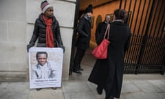 A protester lobbies Lonmin shareholders