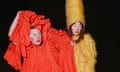 Moina Moin (left) wears a tangerine costume and stage makeup, Freya Tate (right) wears a yellow feathered costume.