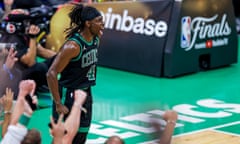 Boston Celtics guard Jrue Holiday celebrates as his team make their way to victory over the Dallas Mavericks during Game 2 of the NBA finals