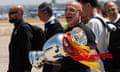 Luis de la Fuente carries the Euro trophy upon their arrival at Adolfo Suárez Madrid–Barajas Airport in Madrid, Spain the morning after the Euro 2024 final