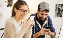 Young couple with smartphones