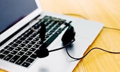 Headset on laptop keyboard, with no person in sight.