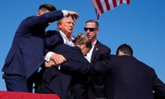 Republican presidential candidate former President Donald Trump is surround by U.S. Secret Service agents at a campaign rally, Saturday, July 13, 2024, in Butler, Pa. (AP Photo/Evan Vucci)