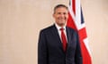 James Timpson smiles as he poses for a photograph in front of a union flag at No 10 Downing Street following his appointment to cabinet by Sir Keir Starmer