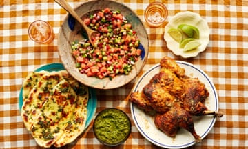 Ravinder Bhogal’s home-cooked tandoori feast (clockwise from right): spatchcock tandoori chicken with coriander chutney, grilled garlic naan and watermelon and cucumber kachumber.