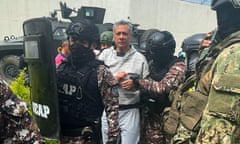 Members of Ecuador's Special Penitentiary Action Group escort Jorge Glas at a maximum security prison