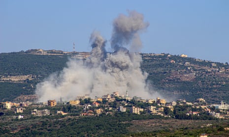 Smoke rises over a village