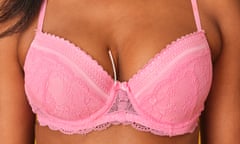 woman in pink bra with underwire poking out