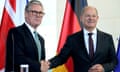 German Chancellor Olaf Scholz, right, and Britain's Prime Minister Keir Starmer shake hands after a press conference in Berlin, Germany, Wednesday, Aug. 28, 2024. (AP Photo/Ebrahim Noroozi)