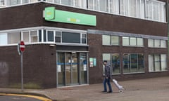 A man walks past a Jobcentre Plus employment office on 22 November 2022 in Stoke-on-Trent, England.
