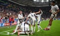 England celebrate after Harry Kane headed home their winner in the first minute of stoppage-time to complete a remarkable turnaround.