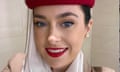 A close-up of Tori Towey wearing a red pillbox hat and white headscarf