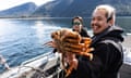 Charles Saunders shows off an enormous dungeness crab, caught as part of a population survey by the Nuxalk Guardian Watchmen.