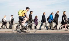 Rush hour commuters making their way across London Bridge