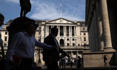 People walk in front of the Bank of England