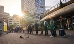 Long queue of voters wait in line in pedestrianised area