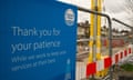 A sign from Thames Water while repair work takes place on a residential street